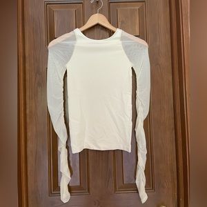 Free People intimately long sleeved top with sheer mesh sleeves